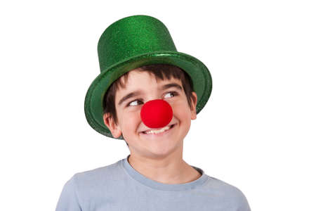 boy with clown nose and hat isolated on white backgroundの写真素材