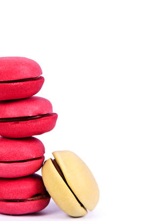 macarons stacked up isolated on white backgroundの写真素材
