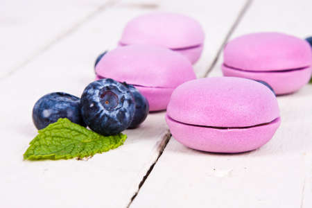 macarons blueberry isolated on white wooden background の写真素材