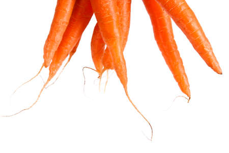 stacked fresh carrots on white background, vegetablesの写真素材