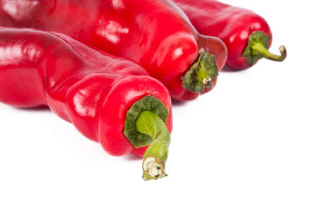 red peppers on white background, fresh vegetables