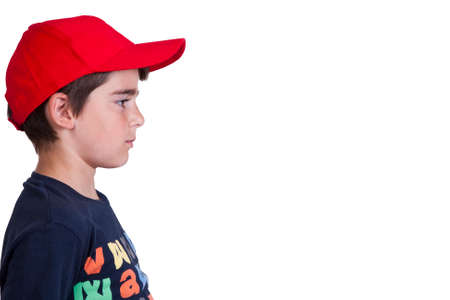 child with hat in profile on white backgroundの写真素材