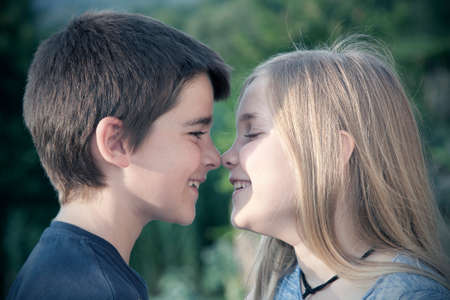 portrait of boy and girl with Nose stuckの写真素材