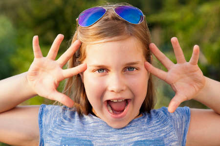 portrait of girl with open hands in foreground