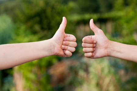 pair of hands with the sign of approval, ok