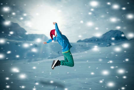 boy jumping in the snowの写真素材
