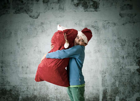 Children with sack of gifts santa clausの写真素材