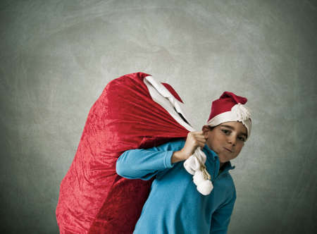 Children with sack of gifts santa clausの写真素材