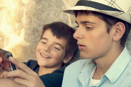 young boys with mobile phone