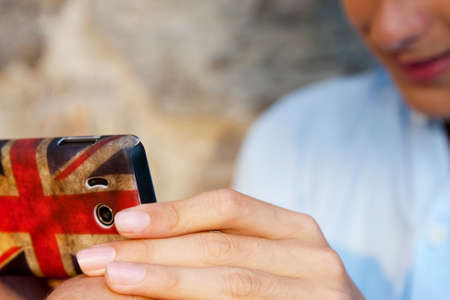 young boy with mobile phoneの写真素材