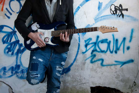 playing guitar in foregroundの写真素材