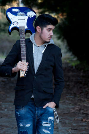 boy with electric guitarの写真素材