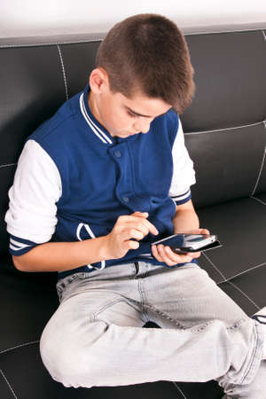 child with mobile phone indoors, technologyの写真素材