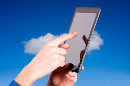 hands with tablet on natural backgroundの写真素材