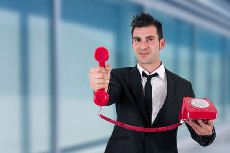 businessman with vintage telephoneの写真素材