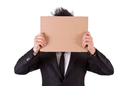 man in suit and cardboard posterの写真素材