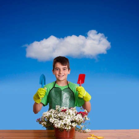 child preparing garden plantsの写真素材