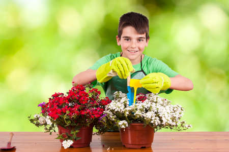 child preparing garden plantsの写真素材