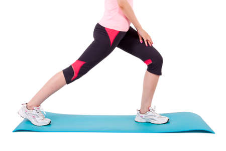 girl on mat doing leg exercises