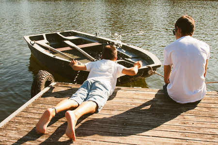 children cooling off in the riverの写真素材