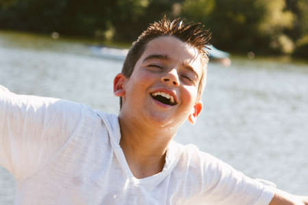 portrait of boy outdoors smilingの写真素材