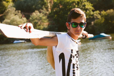 young teenage boy with oarの写真素材