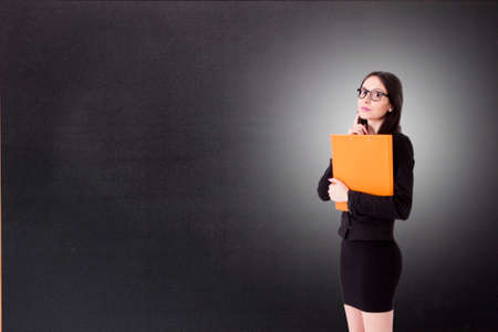 teacher with books on the blackboardの写真素材
