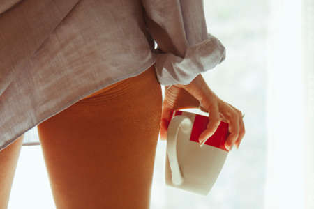 girl with cup of morning coffeeの写真素材