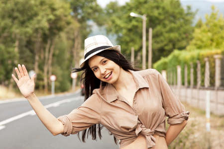 young woman on the roadの写真素材