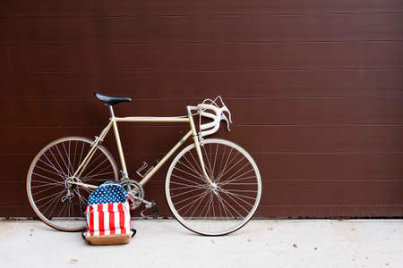 vintage bicycle leaning against the wallの写真素材