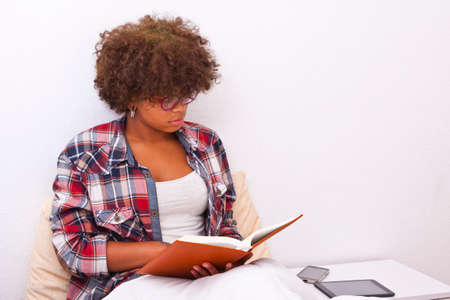 young girl reading lying on the room