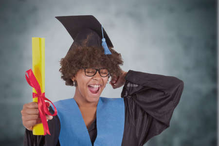 girl with graduation and diplomaの写真素材