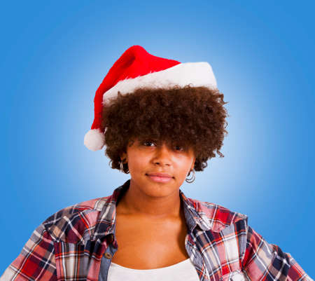 young girl with santa claus hatの写真素材