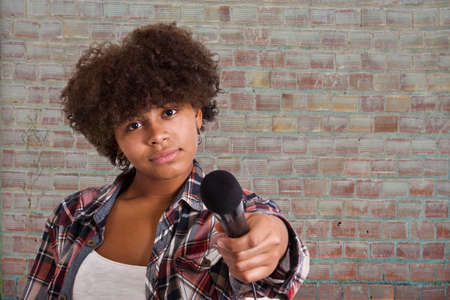 girl pointing the microphoneの写真素材