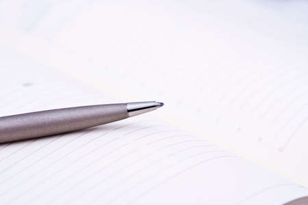 pen in the foreground on the table in the officeの写真素材