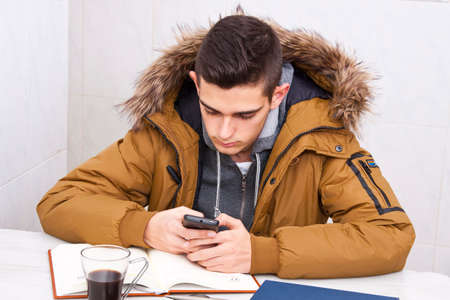 university with the smartphone in the study table