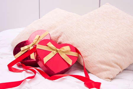 gift boxes with heart shape in the bedroomの写真素材