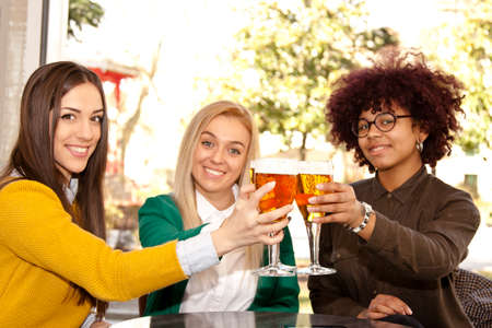 young people celebrating with beer