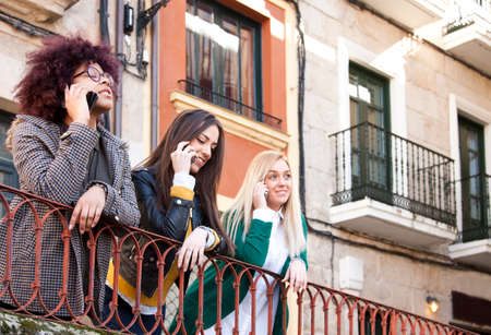 young people with smartphone on streetの写真素材