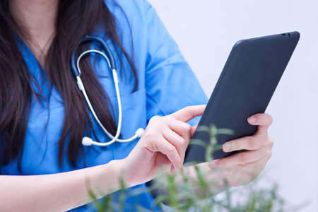 doctors working with the tabletの写真素材