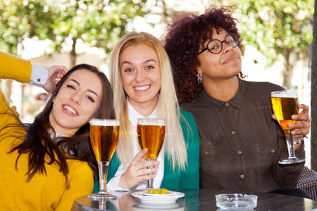 girlfriends in the city having drinksの写真素材
