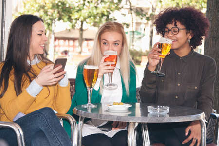 group of friends drinking beerの写真素材