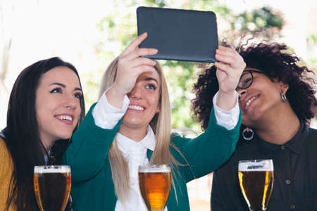 group of friends with the tabletの写真素材