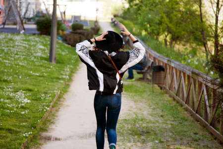 girl walking backの写真素材