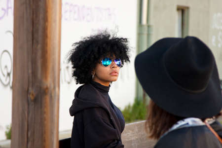 girls talking in the cityの写真素材