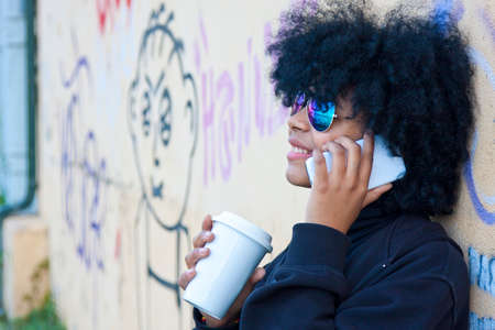 girl talking by phone on the street