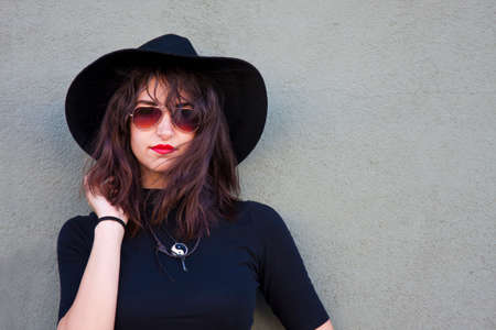 woman urban fashion on the wallの写真素材