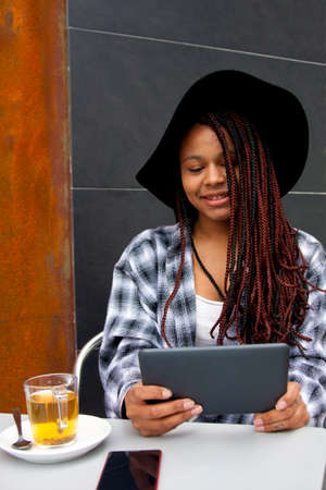 woman with tablet in the cafeteriaの写真素材
