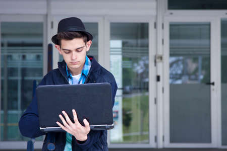 young adult with personal computerの写真素材