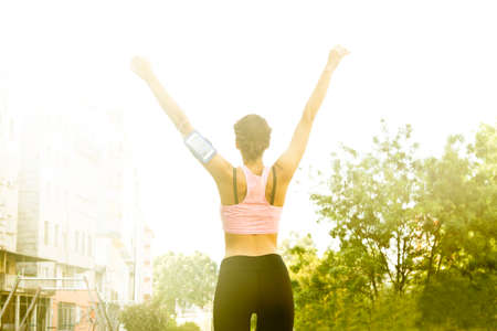 sporty woman celebrating successの写真素材